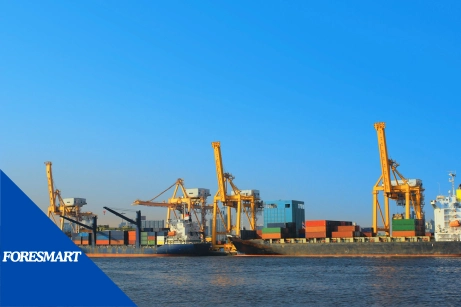 international equipment shipping vessels with huge cranes on the dock